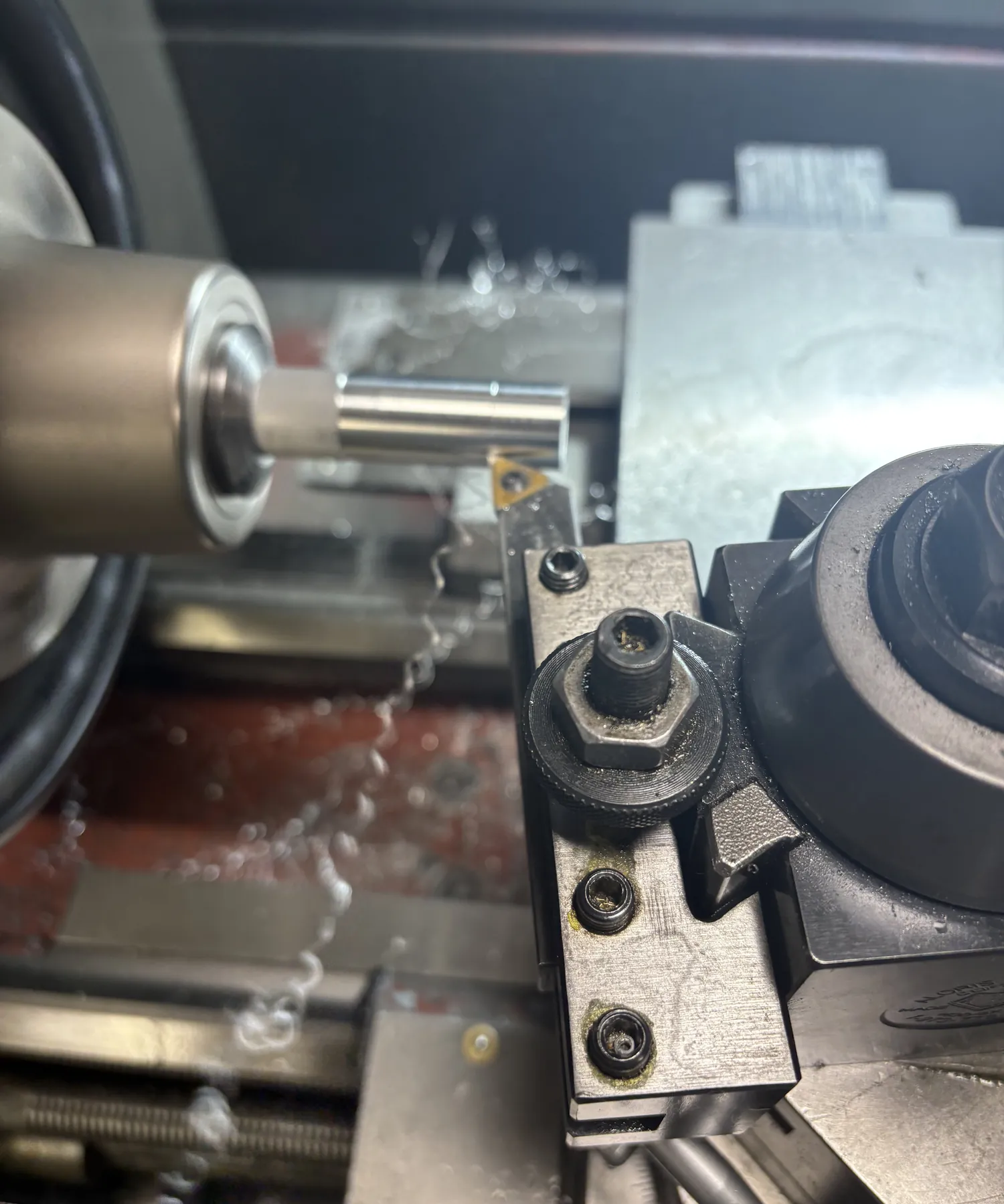 Turning a part on the lathe.