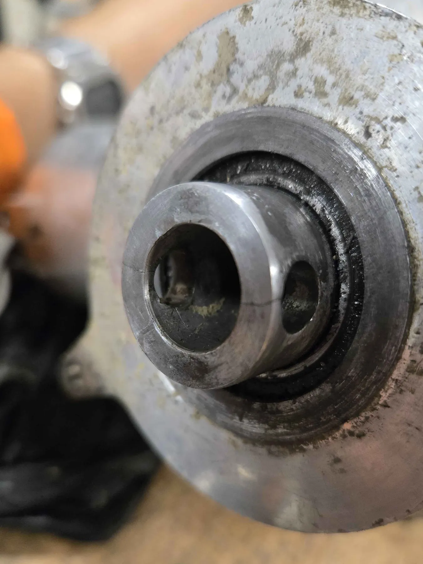 The cracked torque limiter hub. The crack runs out from the cross hole in the boss.